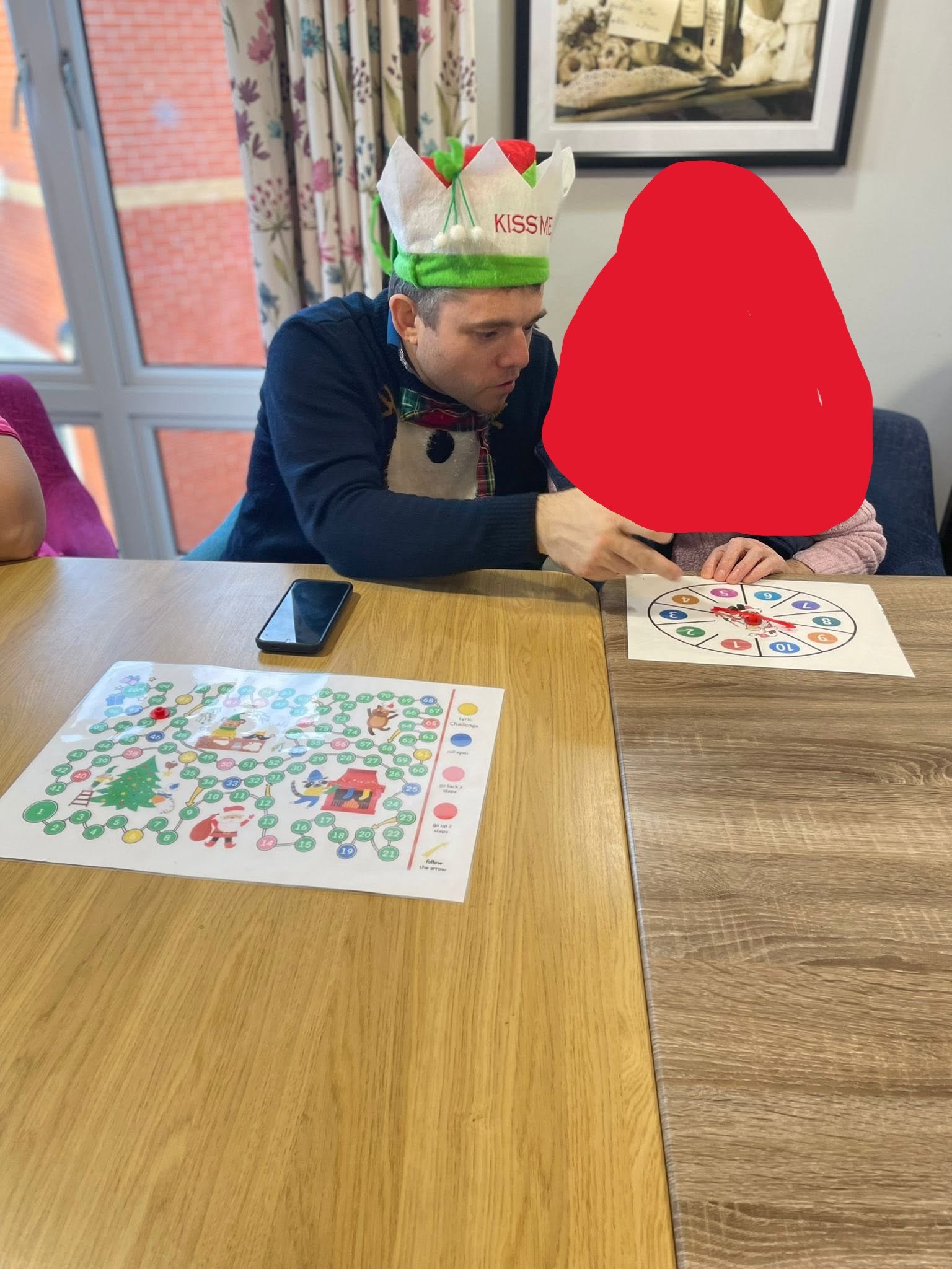 Alex playing a memory game with a resident