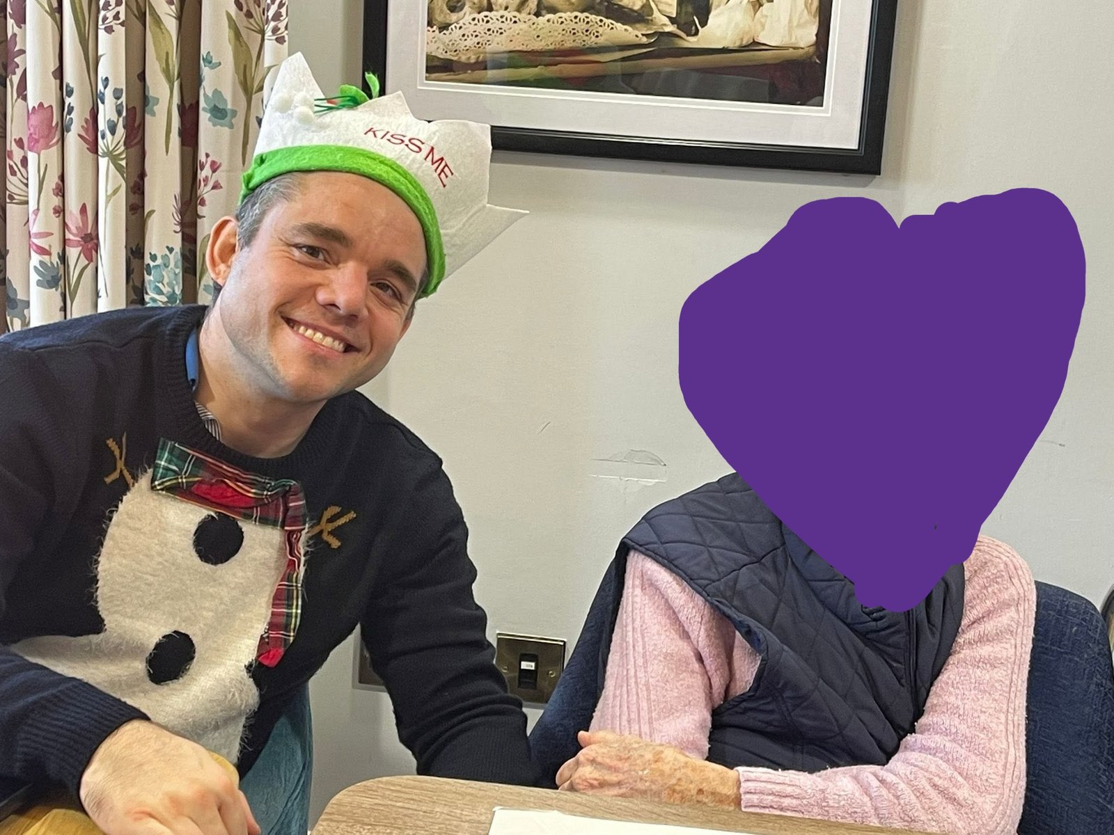 Alex with a resident during a Christmas Memory Club session